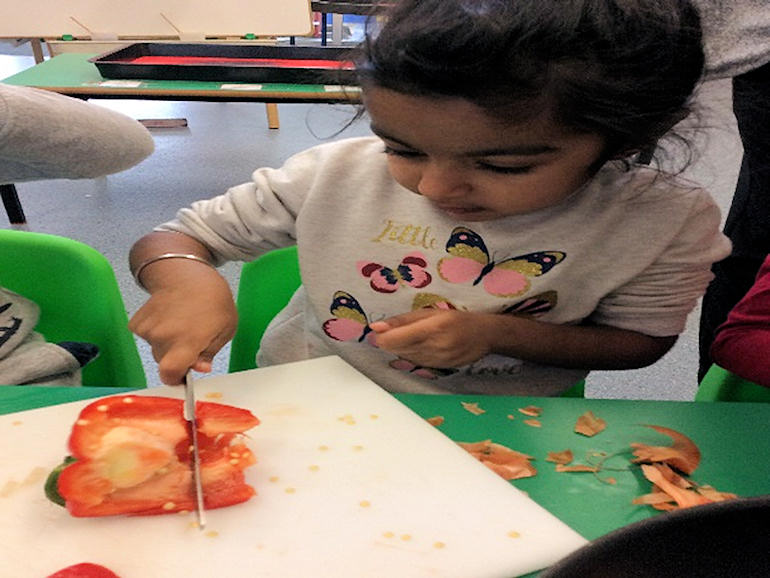 Cutting up vegetables in Nursery