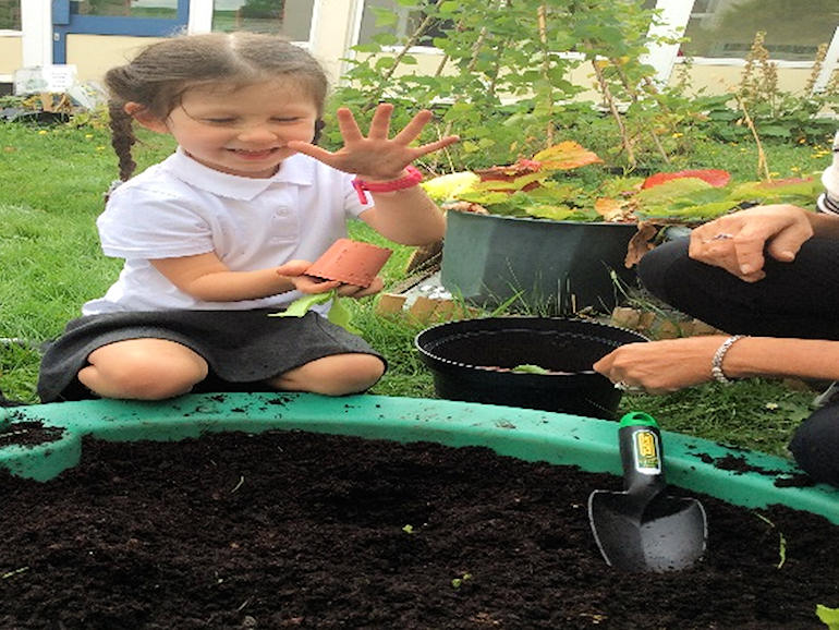 Learning how to plant in Nursery