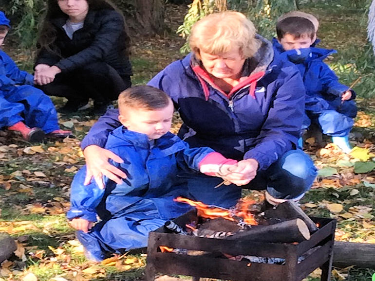 Carefully building a fire at Forest School